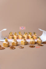 Lemon cream bite treats arranged on a tray with decorative lemon slices and rosemary sprigs