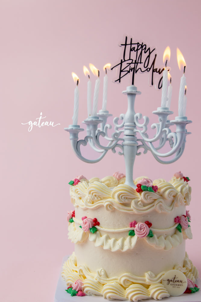 Gateau Gourmet Cafe cake with Lumiere candelabra cake design and decorative pink and red flowers