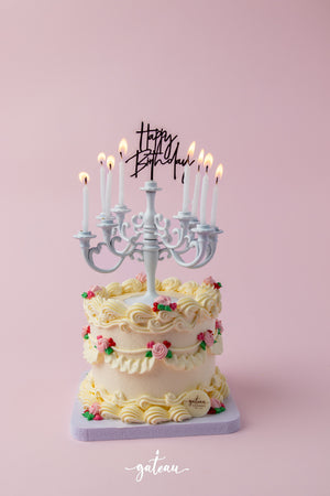 Gateau Gourmet Cafe cake with Lumiere candelabra cake design featuring white candles and floral decorations