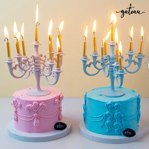 Pink and blue luxury candelabra cakes with gold candles by Gateau Gourmet Cafe