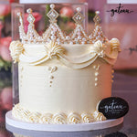 Luxury crown cake by Gateau Gourmet Cafe with elegant pearl decorations and floral icing details