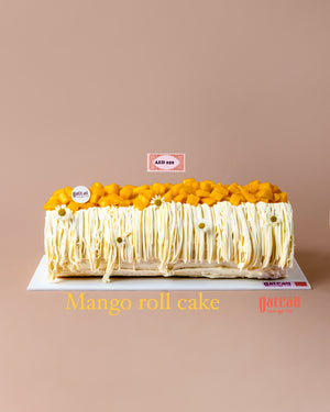 Gateau Gourmet Cafe Mango Swiss Roll Cake topped with fresh mango cubes and decorative cream
