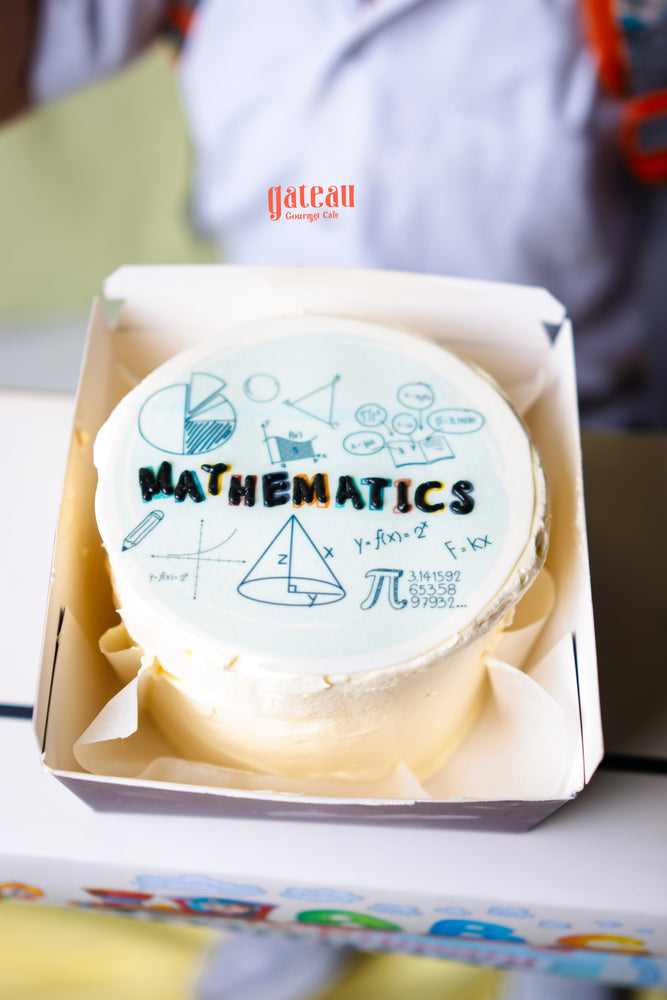 Mathematics theme cake from Gateau Gourmet Cafe decorated with math symbols and formulas