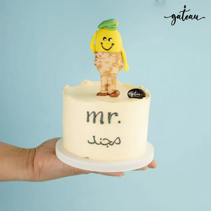 Military service celebration cake with cute soldier figurine and creamy frosting from Gateau Gourmet Cafe