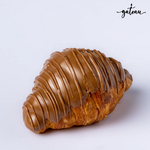 Milk chocolate croissant with rich chocolate drizzle from Gateau Gourmet Cafe on white background