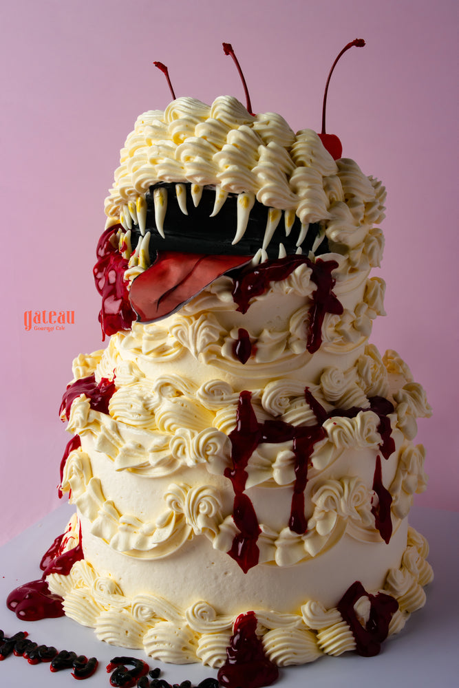 Mimic monster cake from Gateau Gourmet with detailed frosting and a surprise monster face