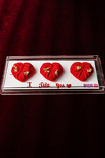 Mini Heart Mousse Cake from Gateau Gourmet Cafe adorned with gold accents and a message of love