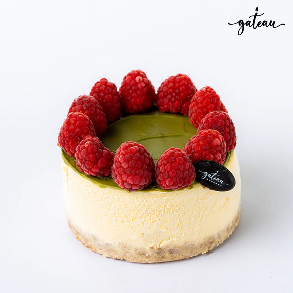 Mini pistachio raspberry cheesecake with fresh raspberries on top from Gateau Gourmet Cafe
