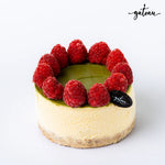 Mini pistachio raspberry cheesecake with fresh raspberries on top from Gateau Gourmet Cafe