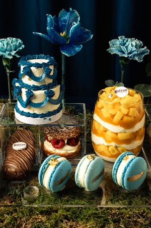 Elegant mini-sweet-dessert-tray-for-eid featuring cake, macarons, and fruit desserts at Gateau Gourmet Cafe