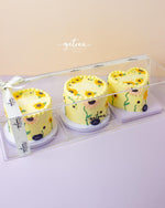 Gateau Gourmet Cafe mirror cake with flowers in yellow floral design in clear gift box