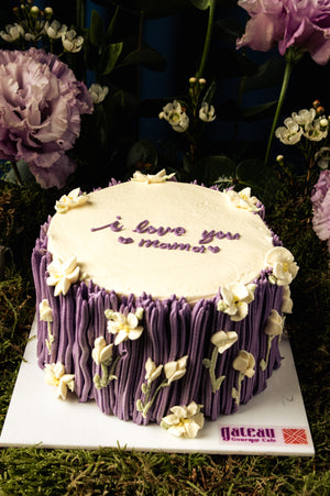 Mother's Day cake delivery with purple floral design and I love you Mom message from Gateau Gourmet Cafe