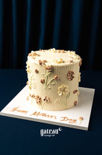 Gateau Gourmet Cafe Mother's Day cakes with elegant floral buttercream design on white cake