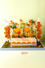 Gateau Gourmet Cafe orange flavored dessert for summer cake decorated with orange flowers and dried orange slices