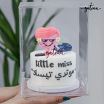 Personalized 3D cake decoration featuring a woman and a car design for special celebrations