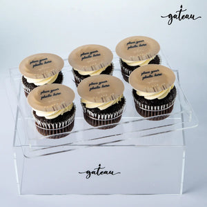 Box of six personalized cupcake gifts with chocolate base and customizable photo toppers from Gateau Gourmet Cafe