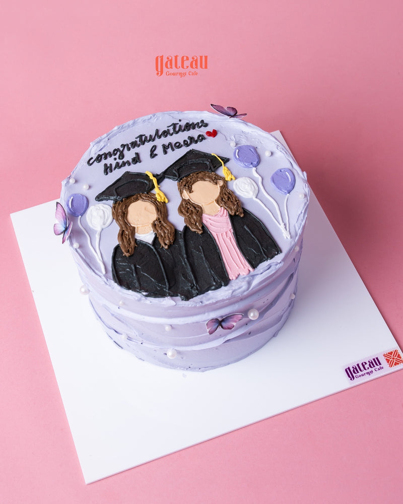 Purple cake with personalized graduation cake design featuring two graduates in caps and gowns and balloons
