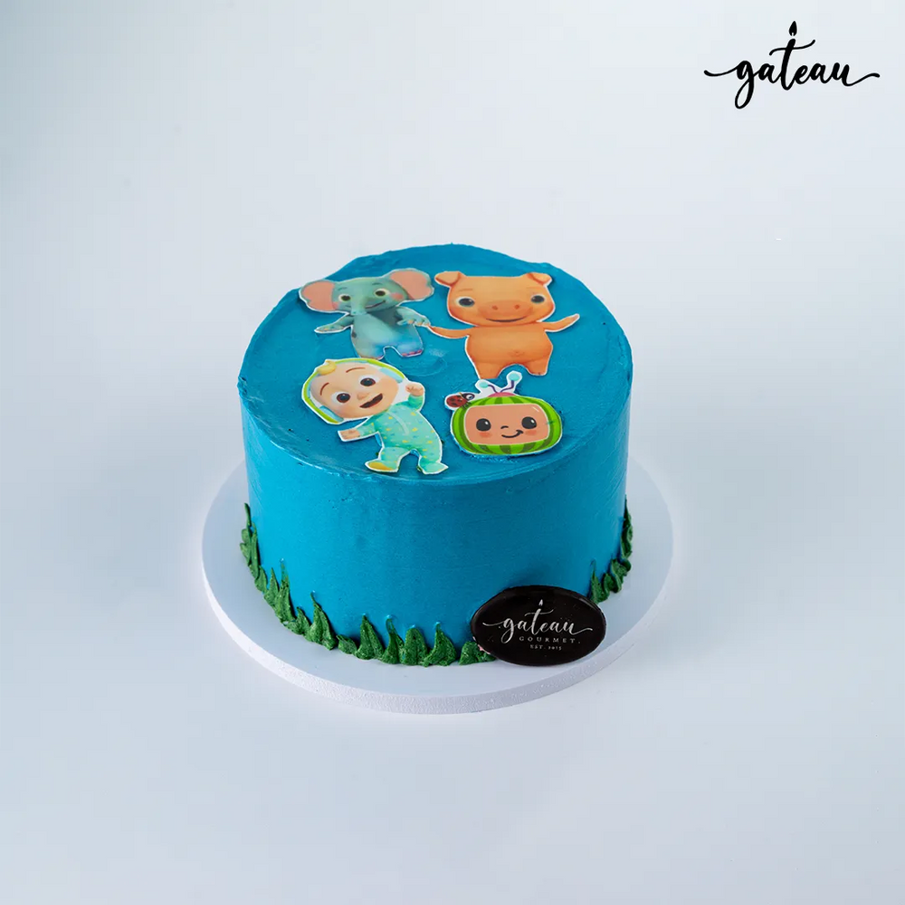 Gateau Gourmet Cafe blue cake with photo edible print cake featuring cute cartoon characters on top