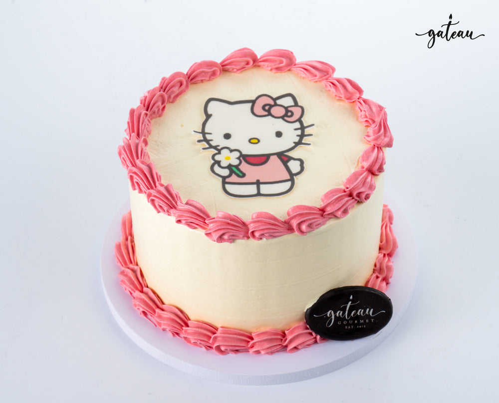 Gateau Gourmet Cafe Hello Kitty photo edible print cake with pink frosting border on white background