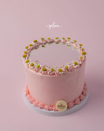 Gateau Gourmet Cafe pink custom mirror cake with floral decorations and smooth frosting on white base