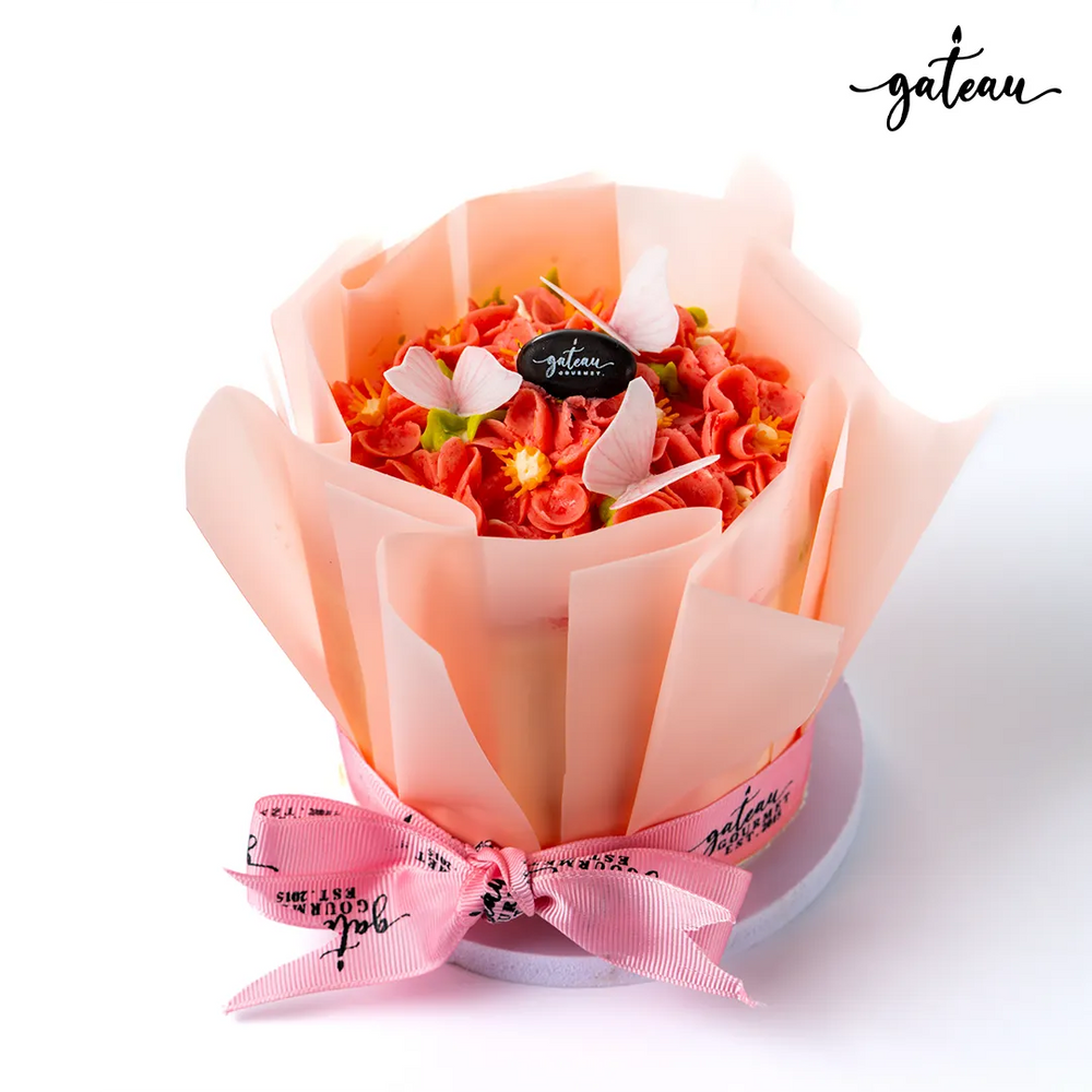 Pink Flowers in Bloom Cake Bouquet with delicate petals and a decorative ribbon from Gateau Gourmet Cafe