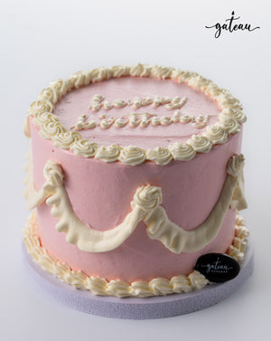 Pink white curtain birthday cakes with decorative icing and joyful birthday message on top