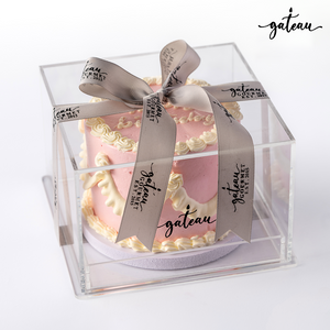 Elegant pink white curtain birthday cakes in a clear box with decorative ribbon for celebrations