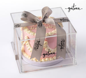 Beautiful pink white curtain birthday cakes in a clear display box with a ribbon bow