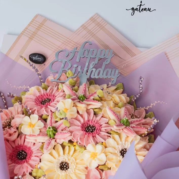 Pink & White Flowers in Bloom Cake Bouquet adorned with a Happy Birthday topper for celebrations