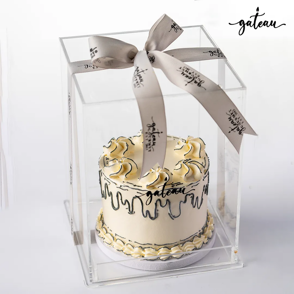 Plain celebration cake in clear box with elegant ribbon from Gateau Gourmet Cafe