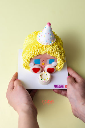 Powerpuff Girls themed cake by Gateau Gourmet Cafe featuring bright yellow frosting and colorful decorations