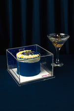 Ramadan celebration cake by Gateau Gourmet Cafe in blue with white and gold decoration in clear display box
