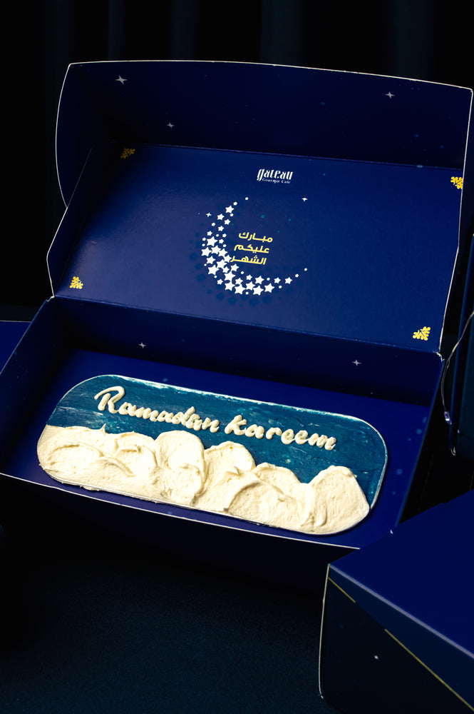 Ramadan Kareem loaf cake by Gateau Gourmet Cafe with decorative white frosting in a blue gift box