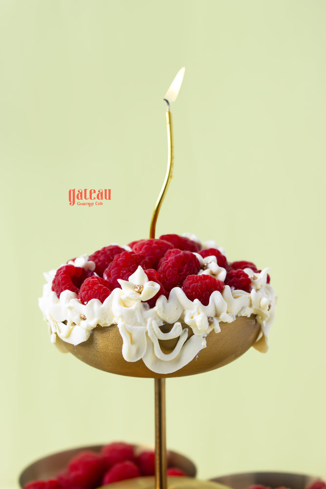 Elegant raspberries dessert cup from Gateau Gourmet Cafe topped with fresh raspberries and cream