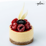 Gateau Gourmet Cafe raspberry cheesecake mini topped with fresh raspberries and white chocolate decoration