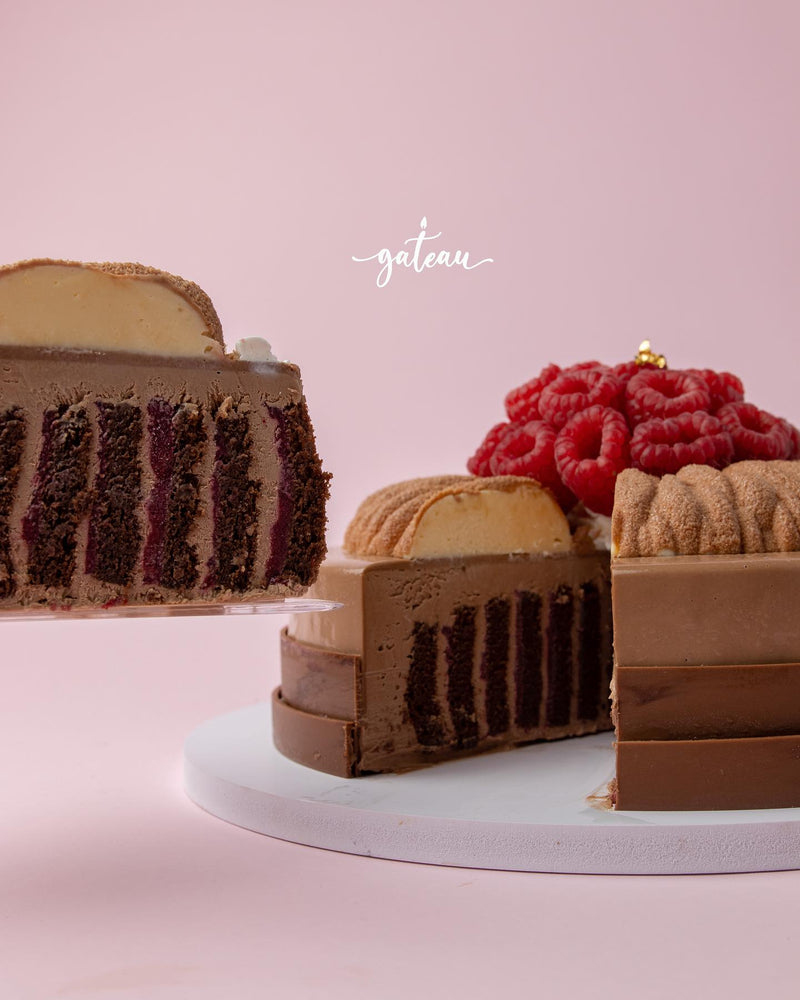 Raspberry chocolate roll cake from Gateau Gourmet Cafe with layers of chocolate and raspberry filling