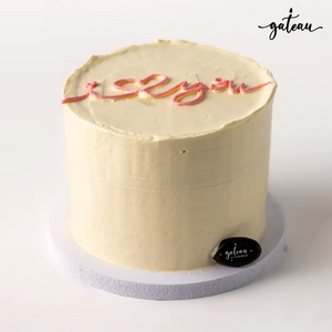 Romantic I Love You cake by Gateau Gourmet Cafe with smooth cream frosting and red script decoration