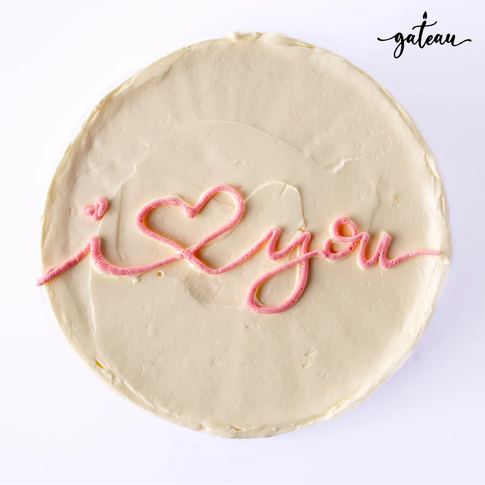 Gateau Gourmet Cafe romantic I Love You cake with white frosting and pink script decoration