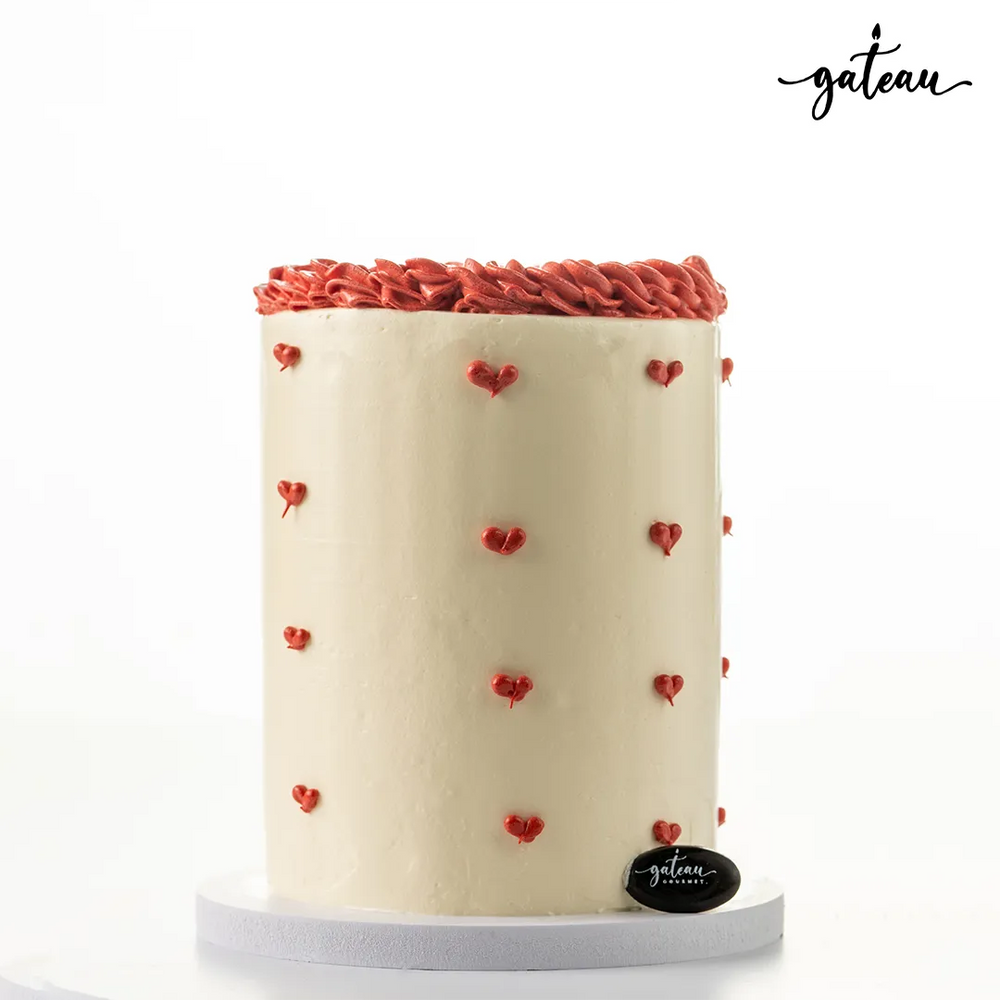 Delicious romantic I Love You cake decorated with pink hearts and a smooth cream finish