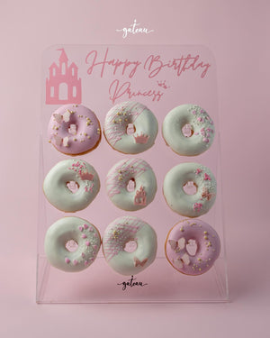 Gateau Gourmet Cafe special occasion donut treats decorated with pink and white frosting and birthday princess theme