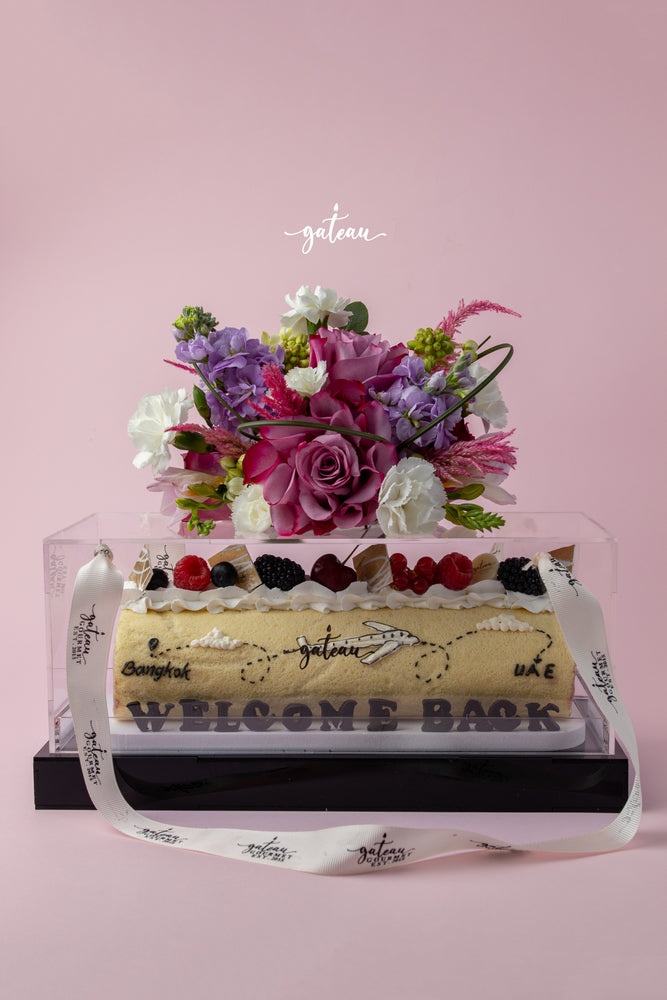 Gateau Gourmet Cafe special occasion Swiss roll decorated with fresh berries and flowers in clear box