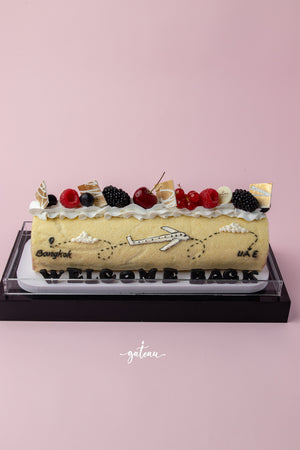 Special occasion Swiss roll cake decorated with fresh berries and airplane design for Gateau Gourmet Cafe