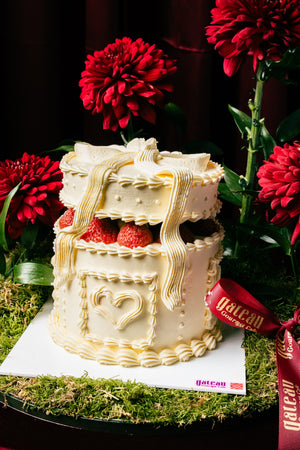 Strawberry white cake arrangement from Gateau Gourmet Cafe with layered cream and fresh strawberries