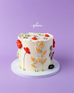 Beautiful summer-flower-cake decorated with vibrant edible flowers on a lavender background