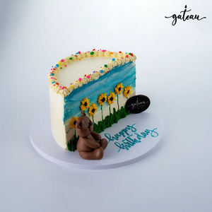 Gateau Gourmet Cafe Sunflower Half Cake design with sunflowers, blue background, and a chocolate bear decoration