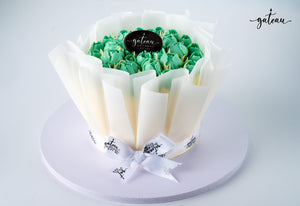 Delicious Gateau Gourmet Cafe Cake with Tulip and Baby Rose Decorations in Green Icing