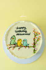 Gateau Gourmet Cafe Tweety bird birthday cake with three colorful birds and cherry blossom decorations