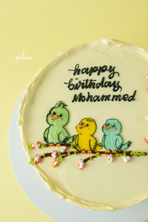Tweety bird birthday cake with colorful bird designs and happy birthday Mohammed message