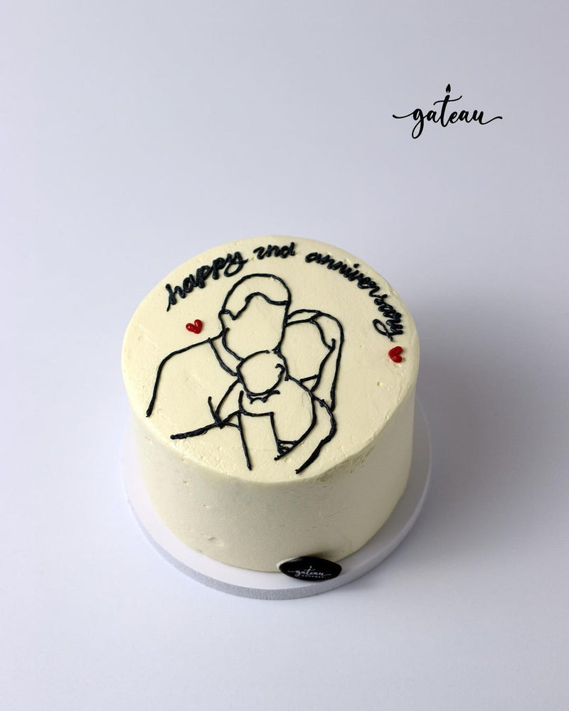 Unique anniversary cake designs by Gateau Gourmet Cafe featuring simple family sketch and happy 2nd anniversary text