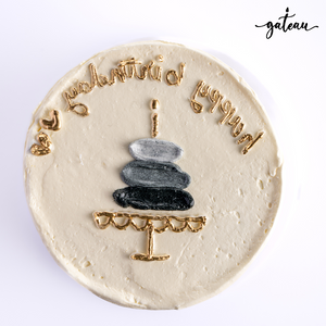 Unique birthday cake designs by Gateau Gourmet Cafe with minimalist stacked stones and gold lettering
